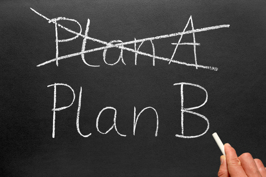A person writing a plan on a blackboard for quitting their job and becoming a full-time affiliate marketer.